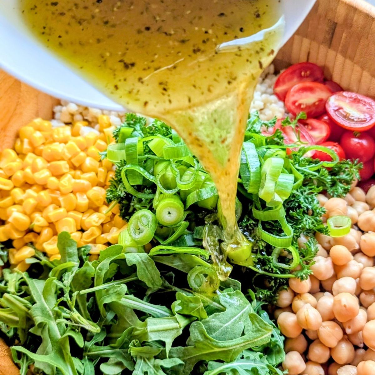 no salt added dressing poured over salad for a low sodium summer salad recipe.