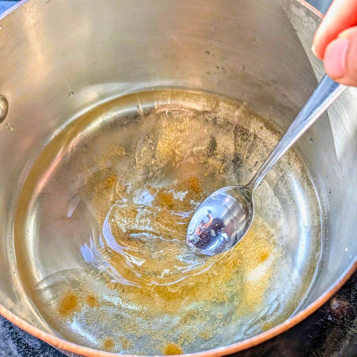 a pot full of rice vinegar and oil and sugar for sushi rice