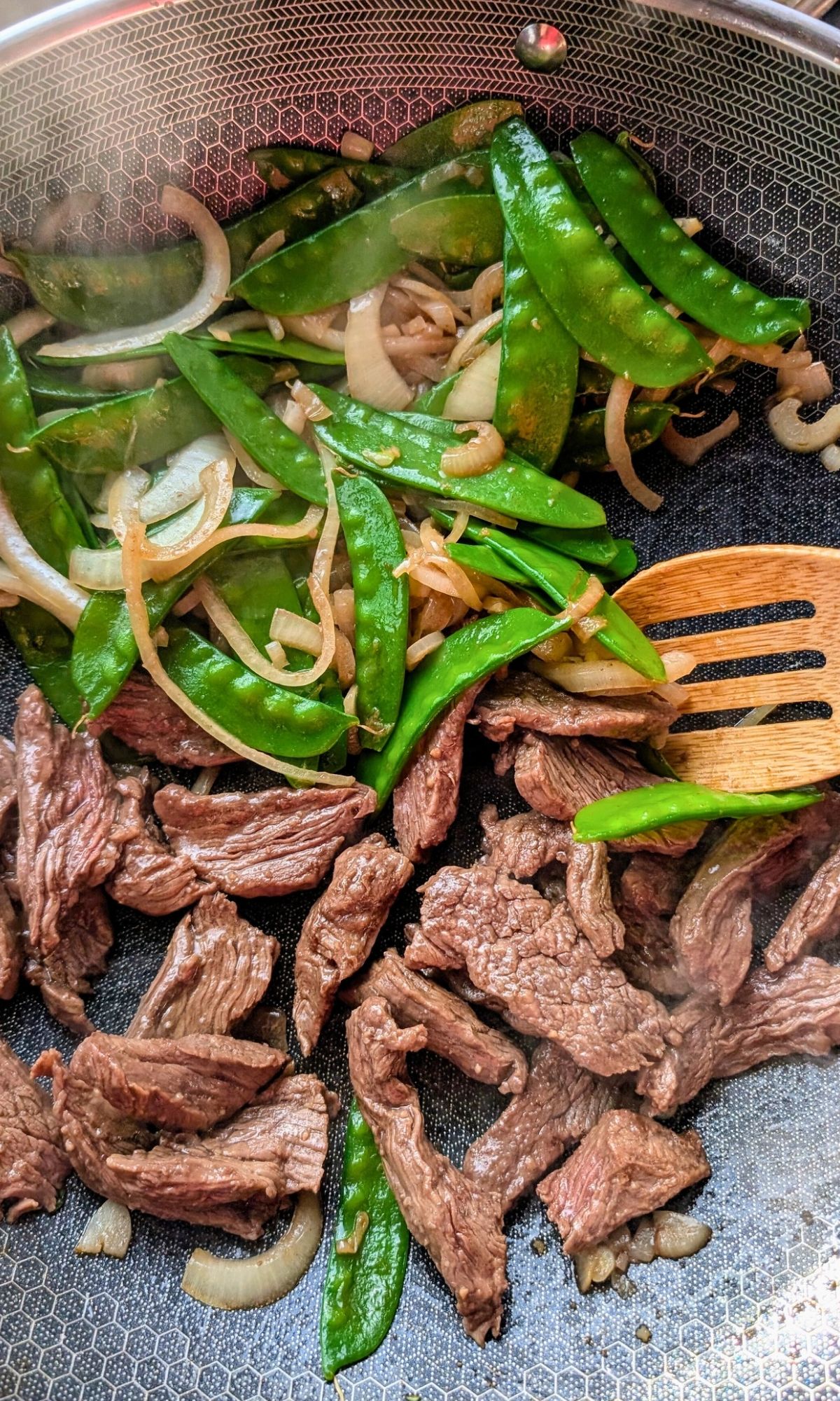 low sodium steak with peapods and onions in a wok