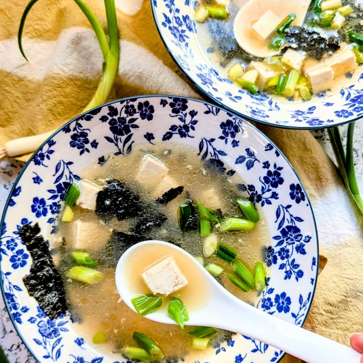 low sodium miso soup with tofu and baby spinach and green onions in reduced sodium miso broth.