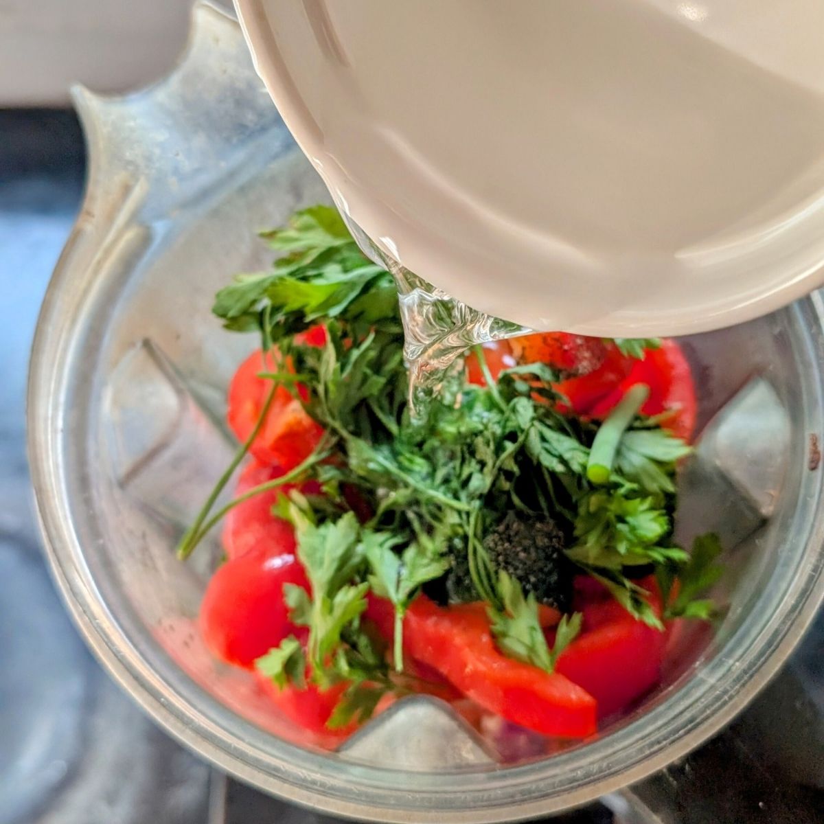 poured water into a blender to make no salt added gazpacho afresh summer recipe.