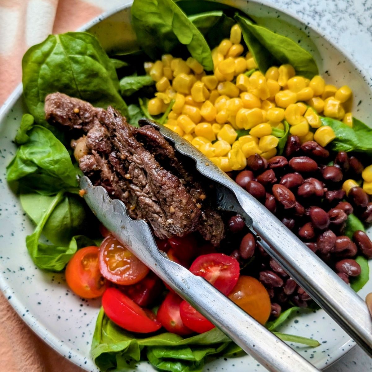 low sodium steak on top of a southwest salad with tex mex flavors.