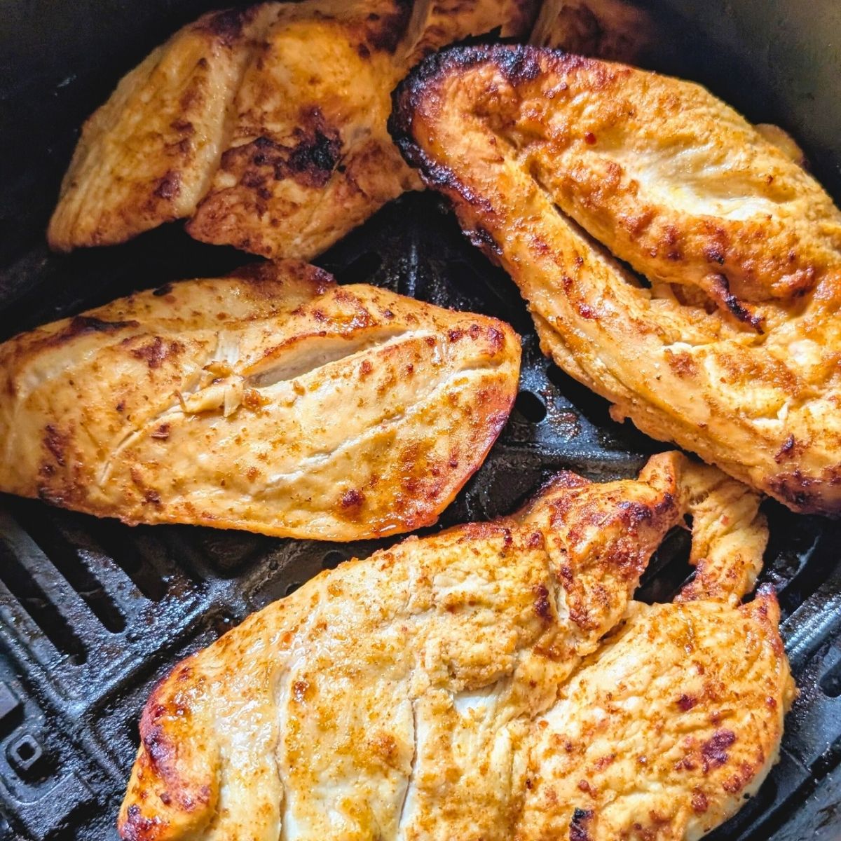 baked low sodium chicken on a pan with mango and lime