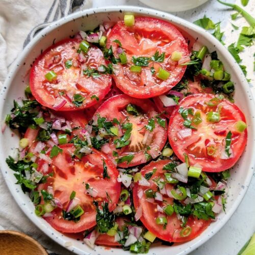 low sodium marinated tomato salad with fresh herbs and garlic in vinegar and oil dressing.