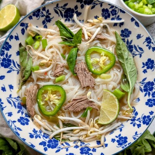low sodium pho soup with beef and rice noodles and lime and bean sprouts